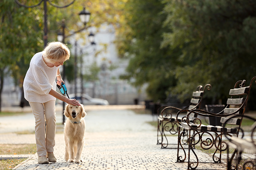senior-woman-walking-with-dog