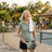 Donna L., Choreograph resident, smiling outdoors near the pool deck.